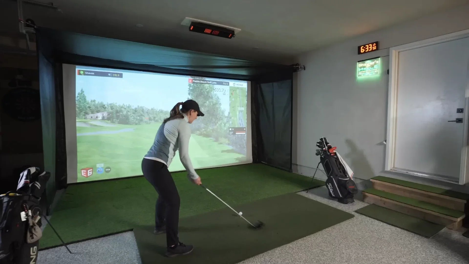 The SportScreen Vanish Series Retractable Golf Studio golf simulator enclosure for indoor golf simulator setup
