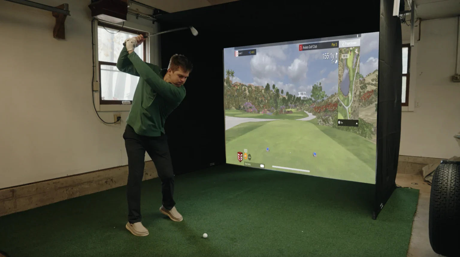The SportScreen Vanish Series Retractable Golf Studio golf simulator enclosure for indoor golf simulator setup