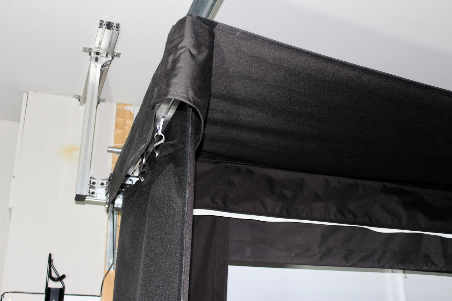 The SportScreen Vanish LITE® Semi-Retractable Golf Enclosure golf simulator enclosure for indoor golf simulator setup