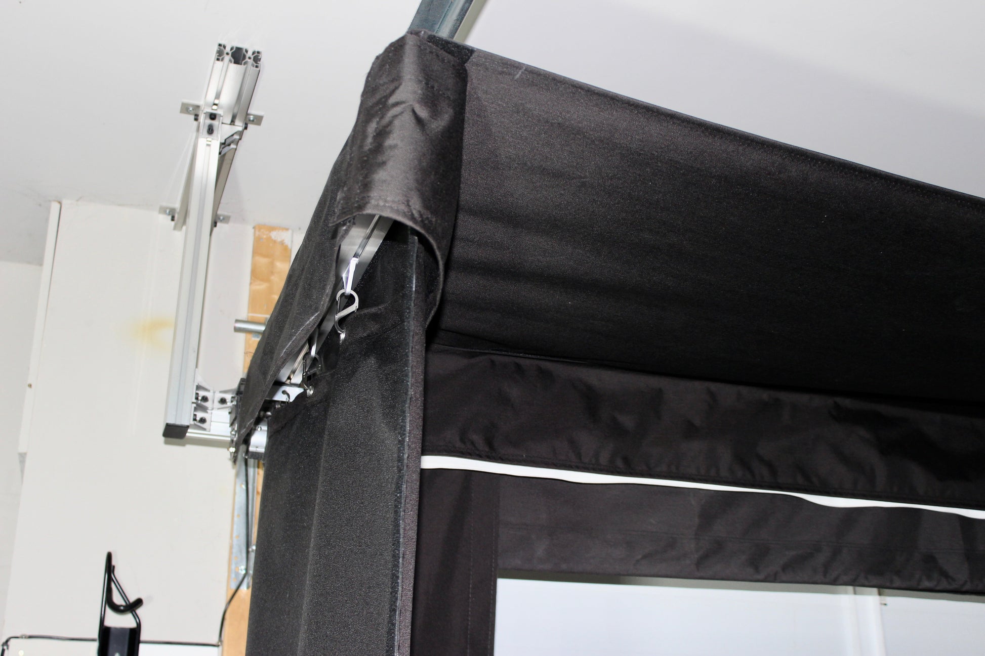 The SportScreen Vanish LITE® Semi-Retractable Golf Enclosure golf simulator enclosure for indoor golf simulator setup