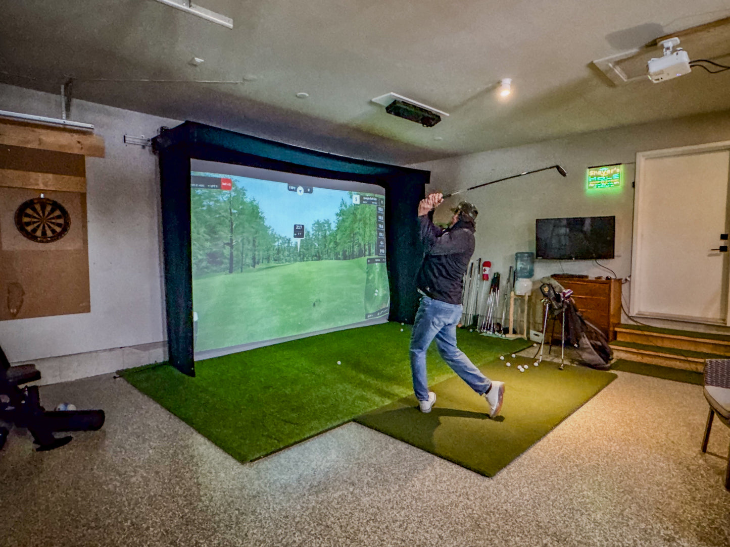 The SportScreen Vanish LITE® Semi-Retractable Golf Enclosure golf simulator enclosure for indoor golf simulator setup