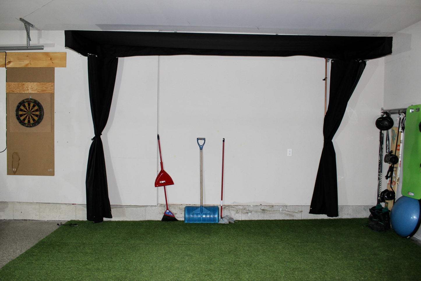 The SportScreen Vanish LITE® Semi-Retractable Golf Enclosure golf simulator enclosure for indoor golf simulator setup