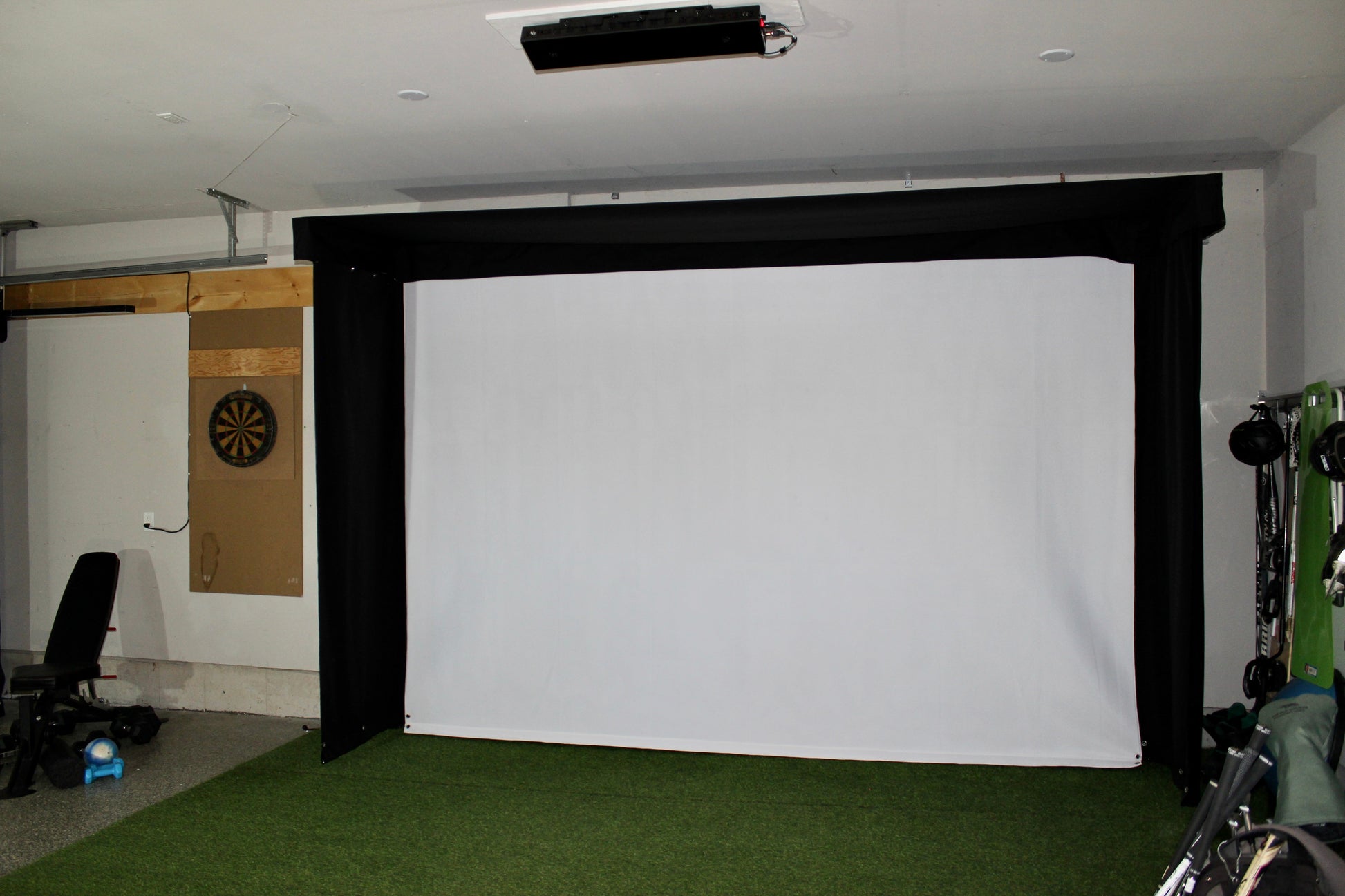 The SportScreen Vanish LITE® Semi-Retractable Golf Enclosure golf simulator enclosure for indoor golf simulator setup