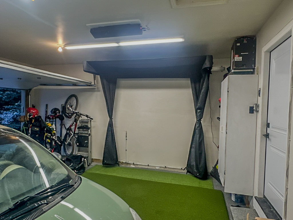 The SportScreen Vanish LITE® Semi-Retractable Golf Enclosure golf simulator enclosure for indoor golf simulator setup