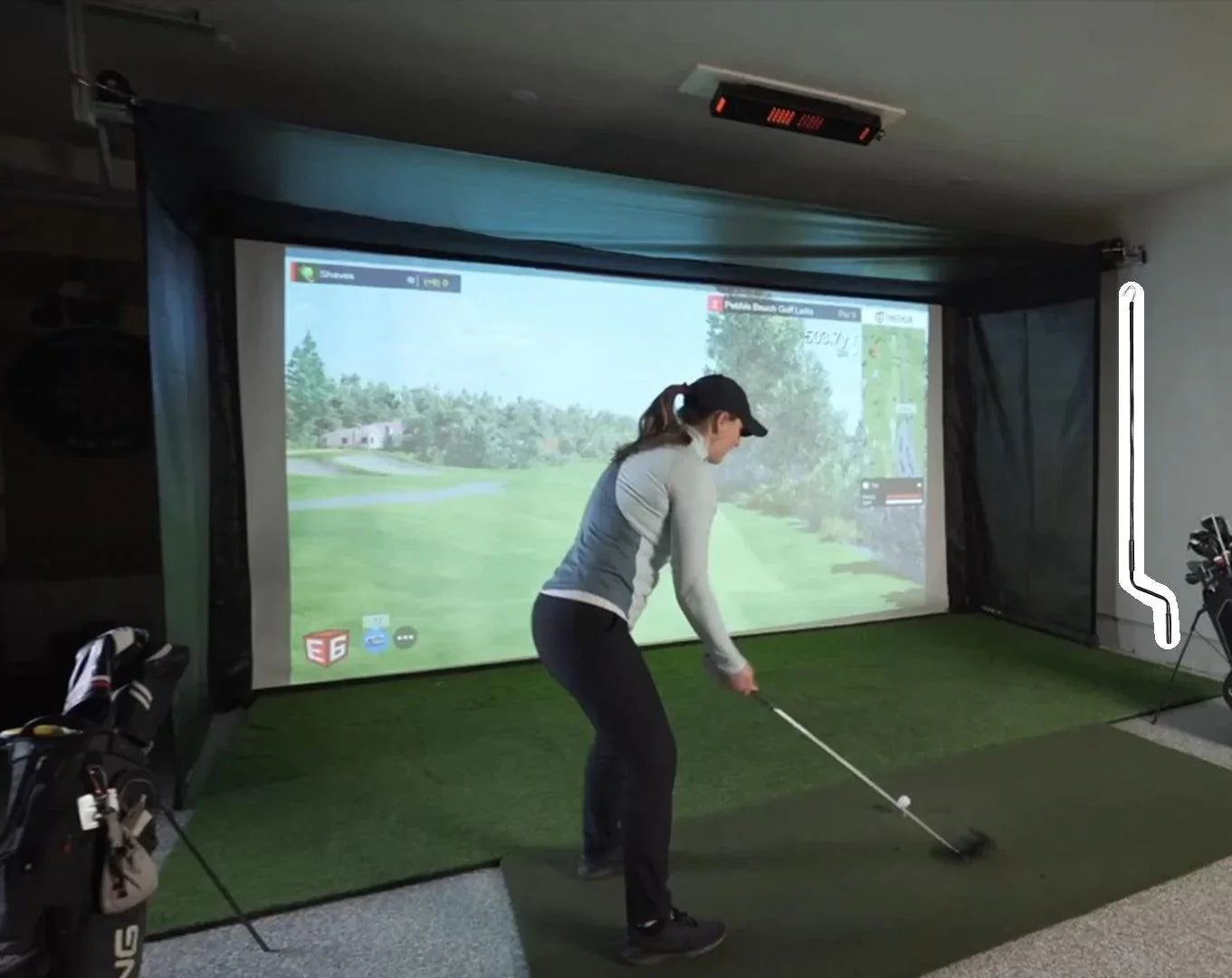 The SportScreen Vanish Series Retractable Golf Studio golf simulator enclosure for indoor golf simulator setup