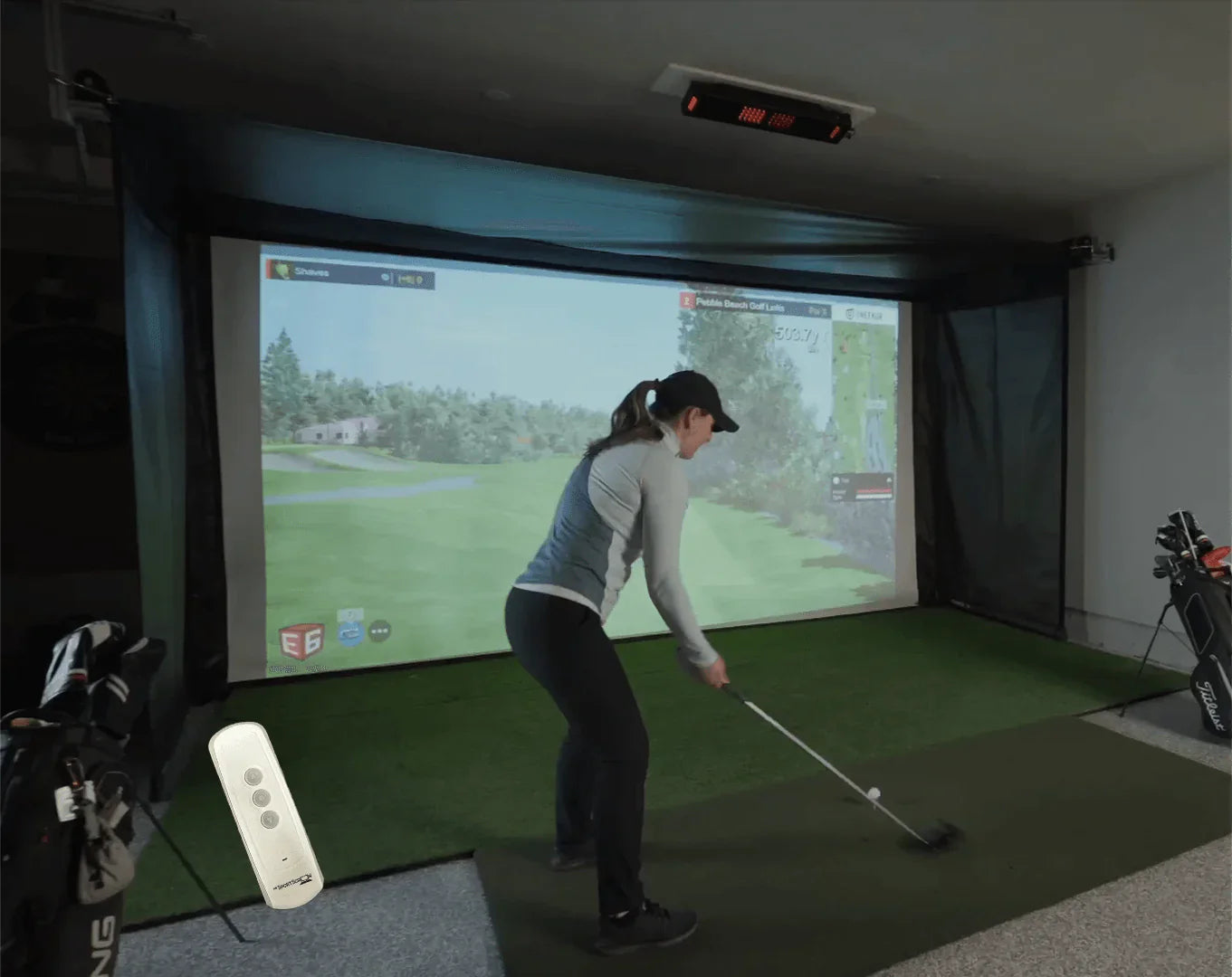 The SportScreen Vanish Series Retractable Golf Studio golf simulator enclosure for indoor golf simulator setup