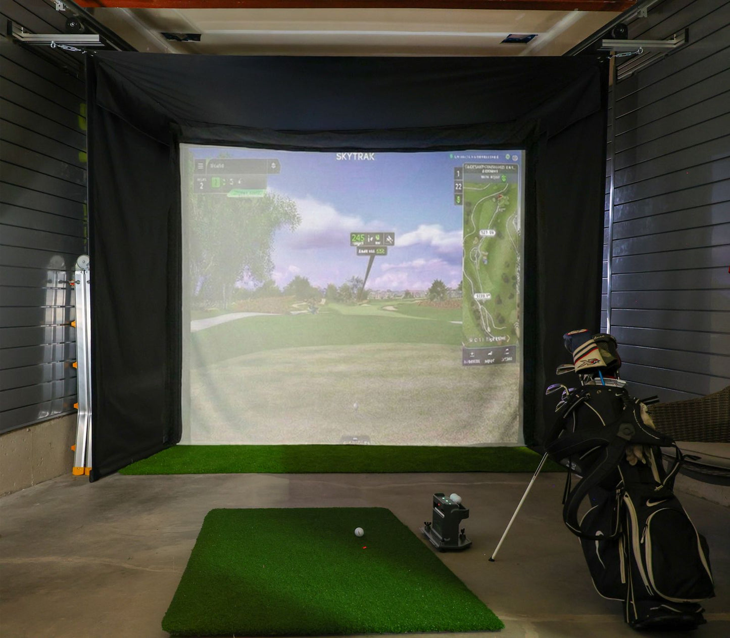 The SportScreen Vanish Series Retractable Golf Studio golf simulator enclosure for indoor golf simulator setup