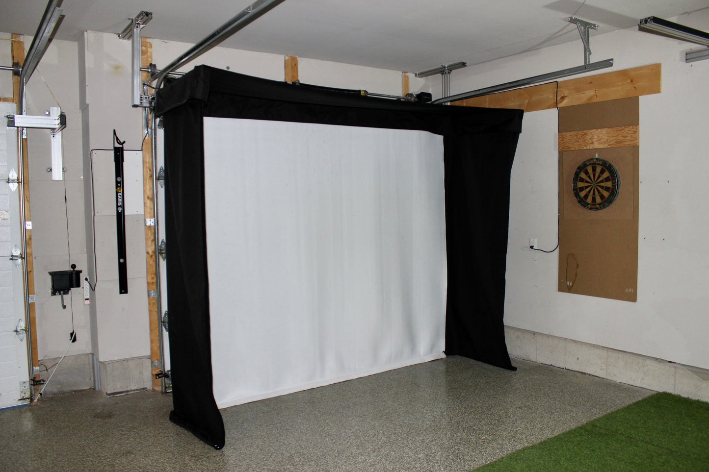 The SportScreen Vanish LITE® Semi-Retractable Golf Enclosure golf simulator enclosure for indoor golf simulator setup