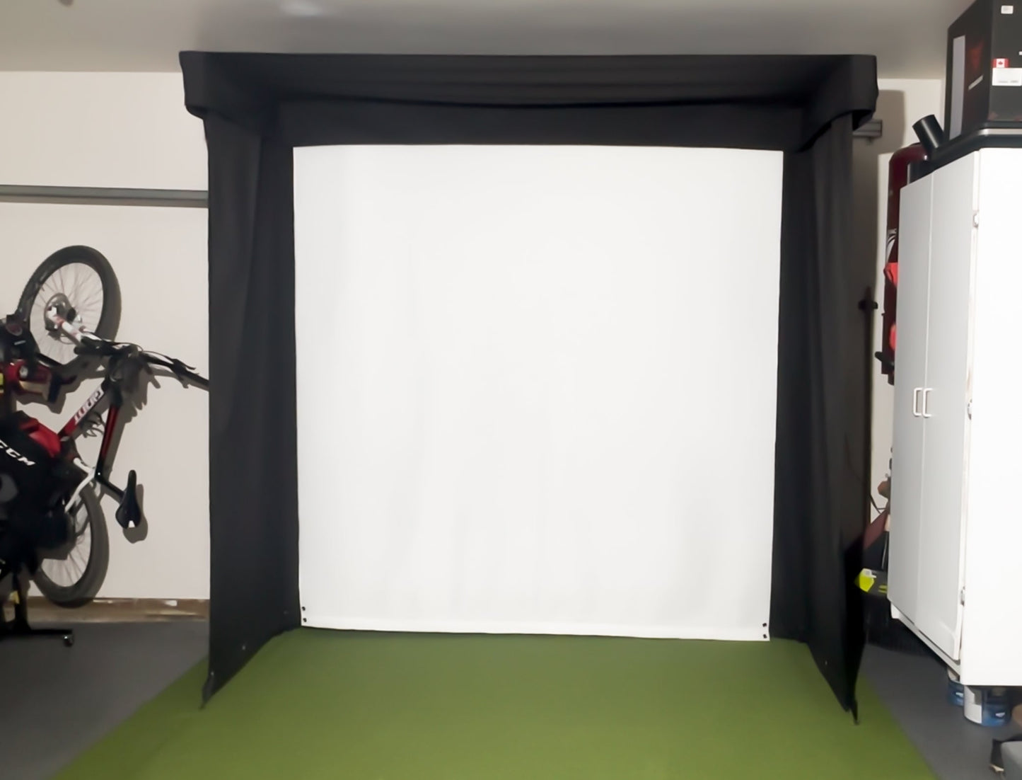 The SportScreen Vanish LITE® Semi-Retractable Golf Enclosure golf simulator enclosure for indoor golf simulator setup